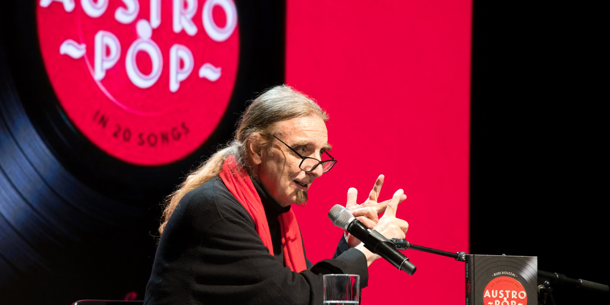"100 Jahre AUSTROPOP – Weltberühmt in Österreich…“ Multi-Media-Lese-Show mit RUDI DOLEZAL